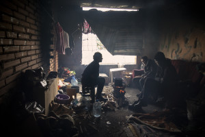 Migrants are seen inside an abandoned building in Bihac, Bosnia and Herzegovina on January 22, 2021. Lots of migrants avoid staying inside the Bosnian official refugee camps because of the hard conditions in which they are forced to live and also because the people hosted in the official camps  cannot go out freely.