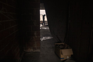 A migrant is seen inside an abandoned building in Bihac, Bosnia and Herzegovina on January 21, 2021. Lots of migrants avoid staying inside the Bosnian official refugee camps because of the hard conditions in which they are forced to live and also because the people hosted in the official camps  cannot go out freely.