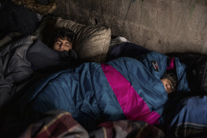 Migrants sleep inside an abandoned building in Bihac, Bosnia and Herzegovina on January 22, 2021. Lots of migrants avoid staying inside the Bosnian official refugee camps because of the hard conditions in which they are forced to live and also because the people hosted in the official camps  cannot go out freely.