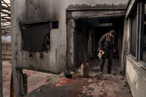 A migrant is seen inside an abandoned factory in Bihac, Bosnia and Herzegovina on January 23, 2021. Lots of migrants avoid staying inside the Bosnian official refugee camps because of the hard conditions in which they are forced to live and also because the people hosted in the official camps  cannot go out freely.