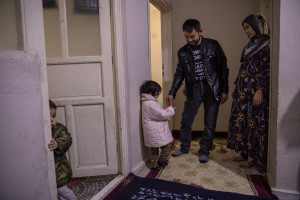 Abdul, 40 years old from Takhar province, Afghanistan is seen with his family inside the house where they live in Van, Turkey on October 25, 2021. Abdul arrived in Turkey for about two months paying 7200 dollars for the entire family.