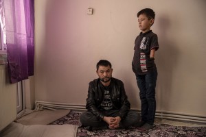 Abdul, 40 years old (left) from Takhar province, Afghanistan is seen with his son Fazel, 9 years old (right) inside the house where they live in Van, Turkey on October 25, 2021. Abdul arrived in Turkey for about two months paying 7200 dollars for the entire family.