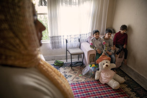 Farida, 31 years old from Afghanistan (left) and her three children are seen inside the house where they have lived for about three months in Van, Turkey on October 21, 2021.