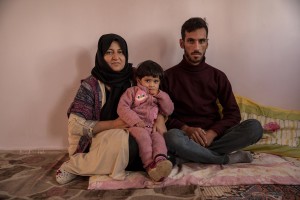 Mustafa, 25 years old, Alifa, 30 years old and their daughter Atina, 1 years old from Afghanistan are portrayed inside the house where they live in Van, Turkey on October 21, 2021. Alifa and Atina have lived in Turkey for two months, while Mustafa has only been able to join them for four days. Mustafa says that two months ago, while trying to cross the border between Iran and Turkey, he and half of the group he was traveling with were stopped and sent back to Iran by the Turkish police, while his wife and daughter managed to cross the border and enter Turkey.