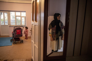 Alifa, 30 years old and her daughter Atina, 1 years old from Afghanistan are seen inside the house where they live in Van, Turkey on October 21, 2021. Alifa and Atina have lived in Turkey for two months, while her husband Mustafa has only been able to join them for four days. Mustafa says that two months ago, while trying to cross the border between Iran and Turkey, he and half of the group he was traveling with were stopped and sent back to Iran by the Turkish police, while his wife and daughter managed to cross the border and enter Turkey.