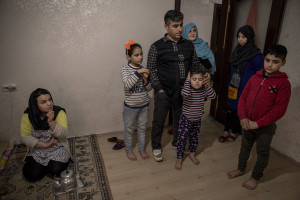 Mohammed, 38 years old from Parwan province, Afghanistan is seen with his family inside the house where he lives in Van, Turkey on October 24, 2021. Mohammed arrived in Turkey for about a month and a half with his two wives and his five children paying 7200 dollars for the entire family.