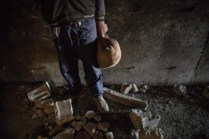 An Afghan refugee is seen with his sack inside a tunnel outside the city of Van, Turkey on October 23, 2021. Refugees use tunnel for temporary shelter on their way to Van or other Turkish cities.