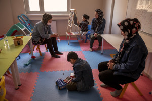 Women and children from Afghanistan are seen inside a playroom of the Kurubas detention center in the border city of Van, Turkey on October 25, 2021. The center opened in April 2017 and hosts mostly Afghans arrested while trying to illegally enter Turkey via Iran. According to Cuma Omurca, director of the migration department in Van province, the goal is to stop irregular immigration and the activity of smugglers.