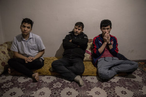 Mujtaba, 19 years old (left), Rasul, 50 years old (center) and Sharif, 21 years old (right) from Kabul, Afghanistan are seen inside a house in Van, Turkey on October 21, 2021.