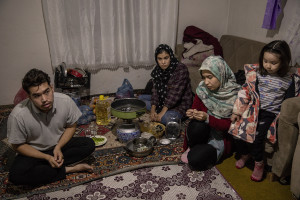 From left: Murtaza, 19 years old, Zahra, 20 years old, Maryam, 22 years old and Zahra, 4 years old,  from Afghanistan are seen inside the house where they live in Van, Turkey on October 21, 2021.