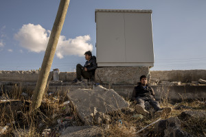 Erfanullah, 17 years old (left) and Rahmatullah, 18 years old (right) from Kabul, Afghanistan rest near a gas station as they wait for a smuggler to continue their journey to Istanbul in Bitlis, Turkey on October 22, 2021. Erfanullah and Rahmatullah have been in Turkey for a month and a half and have paid a thousand dollars each for their trip.
