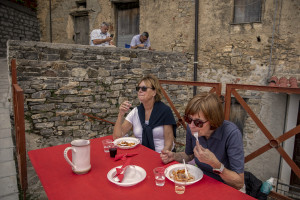 Swedish tourists are seen during a lunch in Cuccaro Vetere, Southern Italy on October 1, 2021. Cuccaro Vetere is a small village of just over five hundred inhabitants in the Salerno area considered “blue zone”, that is one of those places where people live longer than the average.