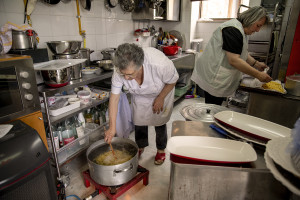 Nicoletta Damato, 78 years old (left) and her daughter Olimpia Volpintesta, 54 years old (right) prepare food inside a kitchen in Cuccaro Vetere, Southern Italy on October 1, 2021. Cuccaro Vetere is a small village of just over five hundred inhabitants in the Salerno area considered “blue zone”, that is one of those places where people live longer than the average.