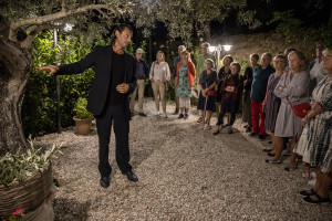 Daniel, a tour guide talks to a group of Swedish tourists before a dinner at “Al Sentiero” farmhouse in Galdo, Southern Italy on October 3, 2021.