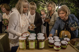 Swedish tourists buy typical products of Cilento before a dinner at “Al Sentiero” farmhouse in Galdo, Southern Italy on October 3, 2021.