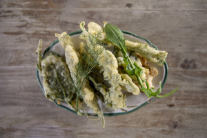 A plate of pancakes (frittelle) with wild herbs prepared by chef Giovanna Voria, 63 years old inside the kitchen of the Corbella farmhouse in Cicerale, Southern Italy on October 3, 2021. Giovanna Voria is an ambassador of the Mediterranean diet in the world, which according to many studies is the basis of longevity. This type of diet involves the consumption of almost exclusively plant foods that are rich in antioxidant biomolecules and protect against the onset of many chronic diseases.