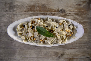 A plate of lagane (with black chickpea flour) and chickpeas prepared by chef Giovanna Voria, 63 years old inside the kitchen of the Corbella farmhouse in Cicerale, Southern Italy on October 3, 2021. Giovanna Voria is an ambassador of the Mediterranean diet in the world, which according to many studies is the basis of longevity. This type of diet involves the consumption of almost exclusively plant foods that are rich in antioxidant biomolecules and protect against the onset of many chronic diseases.