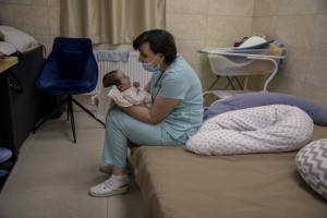 Svitlana Stetsiuk looks after surrogate-born babies inside a special shelter owned by BioTexCom clinic in a residential basement, as Russia’s invasion continues, on the outskirts of Kyiv, Ukraine on March 19, 2022.