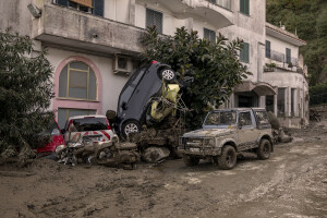 Destroyed cars pile up on the street the day after a landslide hit the Italian holiday island of Ischia, Southern Italy on November 27, 2022.