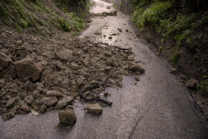 A road covered with stones the day after a landslide hit the Italian holiday island of Ischia, Southern Italy on November 27, 2022.