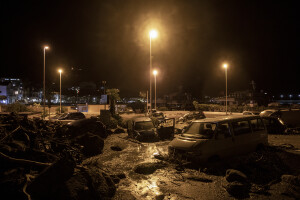 Damaged cars and debris pile up at a street following a landslide on the Italian holiday island of Ischia, Southern Italy on November 26, 2022.