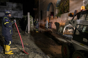 Civil protection operators at work following a landslide on the Italian holiday island of Ischia, Southern Italy on November 26, 2022.