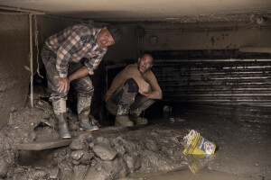 Two men try to enter a garage two days after a landslide hit the Italian holiday island of Ischia, Southern Italy on November 28, 2022.