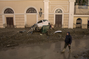 A man walks in the street the day after a landslide hit the Italian holiday island of Ischia, Southern Italy on November 27, 2022.