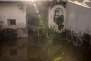 The entrance to a house covered in mud is seen two days after a landslide hit the Italian holiday island of Ischia, Southern Italy on November 28, 2022.