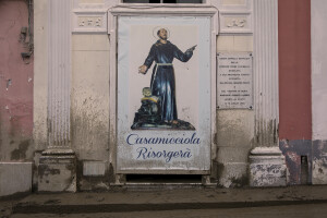 A poster depicting St. Francis of Assisi with the inscription “Casamicciola will rise again” is seen two days after a landslide hit the Italian holiday island of Ischia, Southern Italy on November 28, 2022.