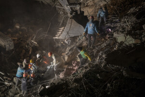 Workers remove a lifeless body from the rubble of a collapsed building in Kahramanmaras, Turkey on February 13, 2023. On February 6, 2023 a powerful earthquake measuring 7.8 struck southern Turkey killing more than 50,000 people.