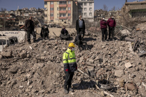 People are seen waiting for rescuers to extract the lifeless bodies of their family members in Kahramanmaras, Turkey on February 13, 2023. On February 6, 2023 a powerful earthquake measuring 7.8 struck southern Turkey killing more than 50,000 people.