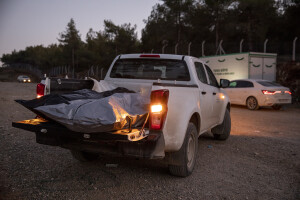 Two black bags containing the corpses of persons extracted from the rubble of a destroyed building are seen on the back of a pick-up in the cemetery of Kahramanmaras, Turkey on February 13, 2023. On February 6, 2023 a powerful earthquake measuring 7.8 struck southern Turkey killing more than 50,000 people.