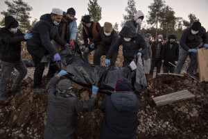 People bury a victim of the earthquake in a cemetery in Kahramanmaras, Turkey on February 13, 2023. On February 6, 2023 a powerful earthquake measuring 7.8 struck southern Turkey killing more than 50,000 people.