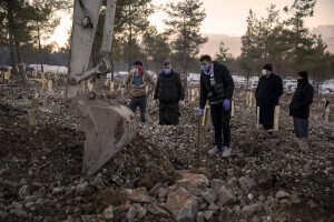 People bury victims of the earthquake in a cemetery in Kahramanmaras, Turkey on February 13, 2023. On February 6, 2023 a powerful earthquake measuring 7.8 struck southern Turkey killing more than 50,000 people.