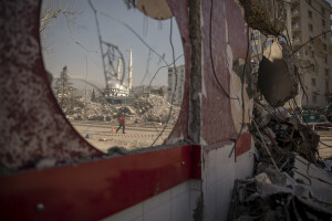 A man walks near the rubble of a destroyed building in Kahramanmaras, Turkey on February 18, 2023. On February 6, 2023 a powerful earthquake measuring 7.8 struck southern Turkey killing more than 50,000 people.