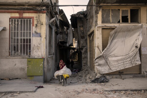 An old woman carries a wheelbarrow in Hatay, Turkey on February 15, 2023. On February 6, 2023 a powerful earthquake measuring 7.8 struck southern Turkey killing more than 50,000 people.