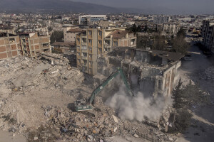 An excavator works to demolish a damaged building in Hatay, Turkey on February 12, 2023. On February 6, 2023 a powerful earthquake measuring 7.8 struck southern Turkey killing more than 50,000 people.