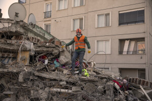 A worker is seen on the rubble of a collapsed building in Hatay, Turkey on February 12, 2023. On February 6, 2023 a powerful earthquake measuring 7.8 struck southern Turkey killing more than 50,000 people.