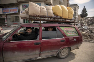 People are seen inside a car after retrieving some items from their home destroyed by the earthquake in Kahramanmaras, Turkey on February 19, 2023. On February 6, 2023 a powerful earthquake measuring 7.8 struck southern Turkey killing more than 50,000 people.