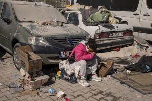 A little girl sits on a plastic box in Kahramanmaras, Turkey on February 13, 2023. On February 6, 2023 a powerful earthquake measuring 7.8 struck southern Turkey killing more than 50,000 people.