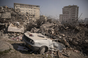 A destroyed car is seen in the rubble of buildings in Kahramanmaras, Turkey on February 18, 2023. On February 6, 2023 a powerful earthquake measuring 7.8 struck southern Turkey killing more than 50,000 people.
