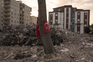 A Turkish flag hangs from a tree in the rubble of a destroyed buildings in Kahramanmaras, Turkey on February 18, 2023. On February 6, 2023 a powerful earthquake measuring 7.8 struck southern Turkey killing more than 50,000 people.