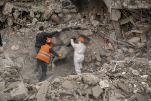 Workers try to remove a lifeless body from the rubble of a collapsed building in Hatay, Turkey on February 12, 2023. On February 6, 2023 a powerful earthquake measuring 7.8 struck southern Turkey killing more than 50,000 people.