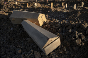 Two coffins for children are seen among graves in a cemetery where victims of the deadly earthquake are buried in Kahramanmaras, Turkey on February 13, 2023. On February 6, 2023 a powerful earthquake measuring 7.8 struck southern Turkey killing more than 50,000 people.