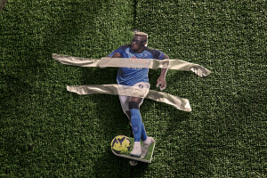 A silhouette of the Nigerian footballer and Napoli striker Victor Osimhen is held in place with masking tape at Spanish neighborhoods in Naples, Southern Italy on April 3, 2023.