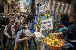A man drinks the so called “limonata a cosce aperte” (lemonade to drink with open thigs) at Spanish neighborhoods in Naples, Southern Italy on April 24, 2023.