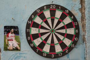 A picture of the Georgian footballer and Napoli striker Khvicha Kvaratskhelia is seen near a target on a wall of the Spanish neighborhoods in Naples, Southern Italy on April 3, 2023.