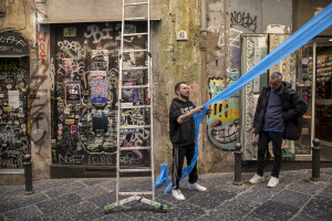 People decorate the streets in blue to celebrate the victory of Napoli’s third championship in the historical center of Naples, Southern Italy on April 26, 2023.