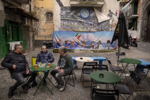 People drink an aperitif at Spanish neighborhoods in Naples, Southern Italy on April 24, 2023.